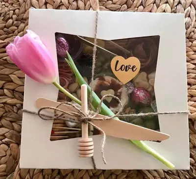 a white card with a pink flower and a heart at 3 B 2 BA home in a Serene, quiet cul de sac in Lone Pine