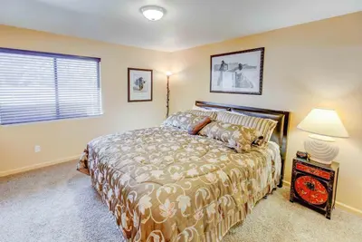 a bedroom with a large bed and a window at San Sierra #16 Hot Tub Sauna Near Skiing in Mammoth Lakes