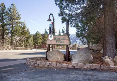 a sign for a resort with rocks on a street at Sherwin Villas #63 Private Deck & Near Lakes in Mammoth Lakes