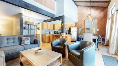 a living room with a couch and chairs and a table at Sherwin Villas Retreat DT in Mammoth Lakes
