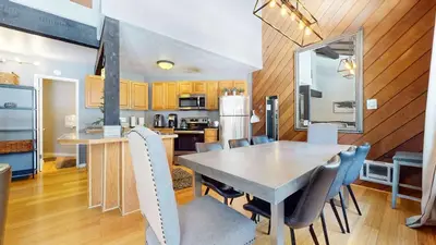 a kitchen and dining room with a table and chairs at Sherwin Villas Retreat DT in Mammoth Lakes