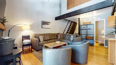 a living room with a couch and a table at Sherwin Villas Retreat DT in Mammoth Lakes