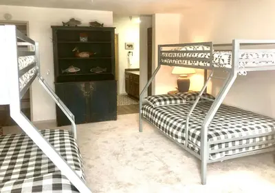 a room with two bunk beds and a desk at Aspen Creek #114 Near Year-Round Activities in Mammoth Lakes
