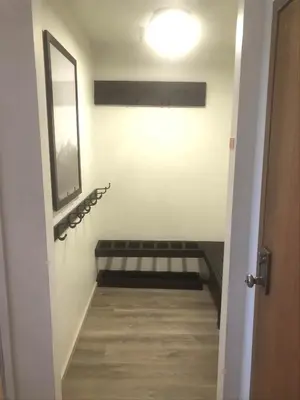 a hallway with a stairway with a mirror and a light at Aspen Creek #114 Near Year-Round Activities in Mammoth Lakes