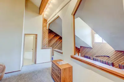 a staircase in a house with a stair case at Aspen Creek #204 Near Golf Fishing & Hiking in Mammoth Lakes