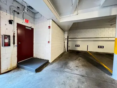 an empty room with a red door in a building at Aspen Creek Shared Amenities Near Hiking in Mammoth Lakes