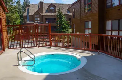 a small pool in front of a house at Aspen Creek #401 Year-Round Outdoor Activities in Mammoth Lakes