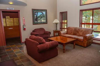 a living room with a couch and a table at Aspen Creek #401 Year-Round Outdoor Activities in Mammoth Lakes