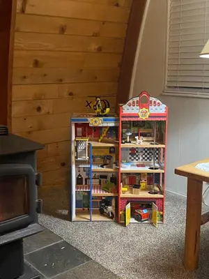 a toy shelf with toys on it in a room at Fire Escape Cabin-Southern Yosemite in Oakhurst