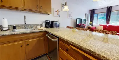 a kitchen with a sink and a counter top at Sierra Manors In the Heart of Mammoth in Mammoth Lakes