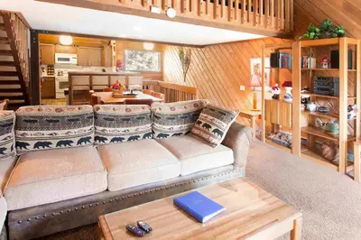 a living room with a couch and a table at Snowcreek #059 Near Shuttle & Activities in Mammoth Lakes