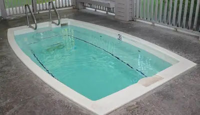 a large pool with blue water in a yard at Snowcreek #630 Near Lakes & Golf in Mammoth Lakes