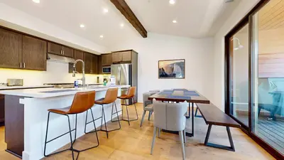a kitchen and dining room with a table and chairs at Cozy Cabin for 8 Close to Eagle Lodge in Mammoth Lakes