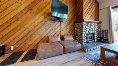 a living room with a couch and a fireplace at Crestview #2 Close to The Village Near Year-Round Outdoor Activities in Mammoth Lakes
