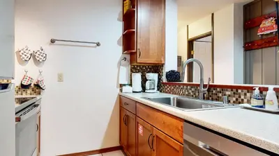 a kitchen with a sink and a counter top at Escape to The Summit Pool & HT Next Door in Mammoth Lakes