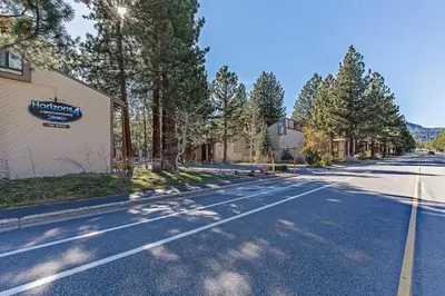 an empty street with trees on the side of a building at Horizons 4 Year-Round Outdoor Activities in Mammoth Lakes