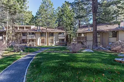 a house with a driveway in front of a yard at Horizons 4 Year-Round Outdoor Activities in Mammoth Lakes