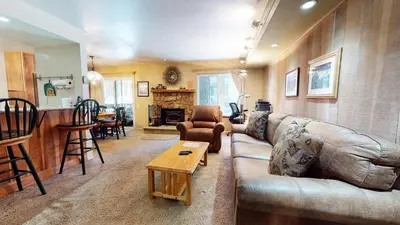 a living room with a couch and a table at Horizons Communal Sauna & Hot Tub in Mammoth Lakes