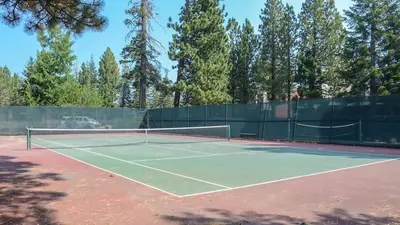 a tennis court with a net on top of it at Summit #20 Near DT Hike Bike & Ski in Mammoth Lakes