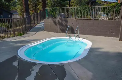 a small blue swimming pool in the middle of a street at Summit #20 Near DT Hike Bike & Ski in Mammoth Lakes