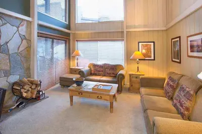 a living room with a couch and a table at Summit #20 Near DT Hike Bike & Ski in Mammoth Lakes