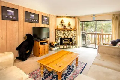 a living room with a teddy bear sitting on a table at Summit #217 A Couples Getaway Dream in Mammoth Lakes