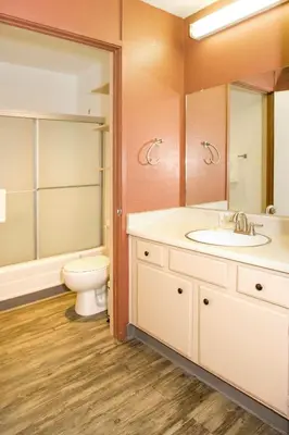 a bathroom with a sink and a toilet and a mirror at Summit #217 A Couples Getaway Dream in Mammoth Lakes