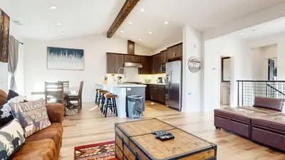 a living room with a couch and a table at An Adventure of a Lifetime 3 BDR 5 Min to Skiing in Mammoth Lakes