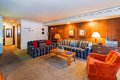 a living room with two couches and a table at Horizons 4 - Year-Round Outdoor Activities in Mammoth Lakes