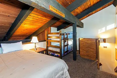 a bedroom with a bed and a wooden ceiling at Horizons 4 - Year-Round Outdoor Activities in Mammoth Lakes