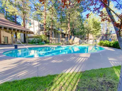 a swimming pool in the middle of a yard at Horizons 4 - Walk to Shops & Eateries in Mammoth Lakes