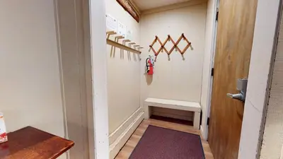 a hallway with a staircase with a bench in it at Horizons Bliss - Near Year-Round Activities in Mammoth Lakes