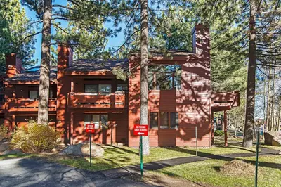 a log home with trees in front of it at Winterset #18 Shared Pool & Near Skiing in Mammoth Lakes