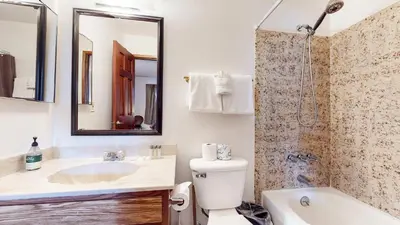 a bathroom with a sink and a toilet and a shower at Mammoth Hygge - Centrally Located in Mammoth Lakes