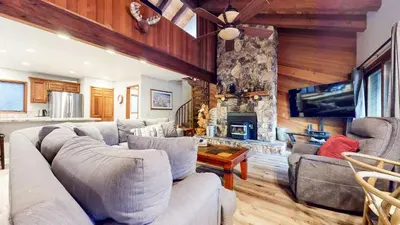 a living room with a couch and a fireplace at Mammoth Pines #02 - Year-Round Activities in Mammoth Lakes
