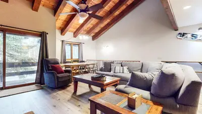 a living room with a couch and a table at Mammoth Pines #02 - Year-Round Activities in Mammoth Lakes