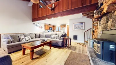 a living room with a couch and a table at Mammoth Pines #02 - Year-Round Activities in Mammoth Lakes