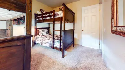 a bedroom with two bunk beds in a room at Mammoth View Villas - Near Hike & Bike Trails in Mammoth Lakes
