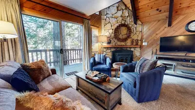 a living room with a couch and chairs and a television at Mammoth View Villas - Near Hike & Bike Trails in Mammoth Lakes