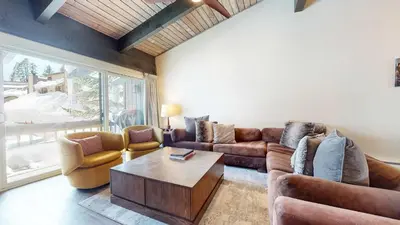 a living room with couches and a coffee table at Mid Century Modern Cabin #212 - Walk to Village in Mammoth Lakes