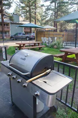 a grill sitting on top of a patio at Mountain Shadows #B08 - Near Hike Bike & Ski in Mammoth Lakes