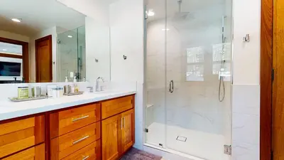 a bathroom with a shower and a sink at Obsidian Dreaming - On the Sierra Star Golf Course in Mammoth Lakes
