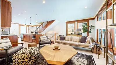 a living room with a couch and a table at Obsidian Ski & Golf Villa - 3 BDR Prime Location in Mammoth Lakes