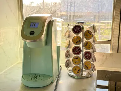 a mixer sitting on a counter next to a window at The Magic Skoolie in Visalia