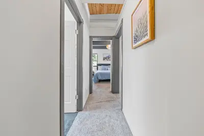 a hallway leading to a bedroom in a house at Tahoe City Retreat - For 8 in Tahoe City