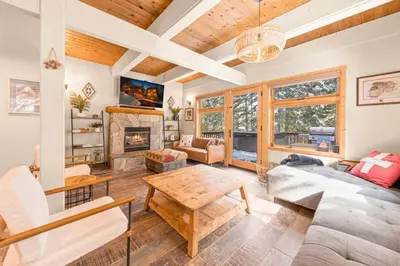 a living room with a couch and a table at Tahoe City Retreat - For 8 in Tahoe City