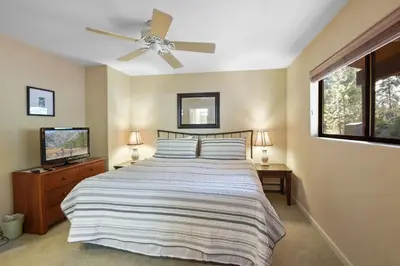 a bedroom with a bed and a ceiling fan at Tranquil Tumbleweed - Close to Skiing & More in Incline Village