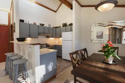 a kitchen and dining room with a table and chairs at Valley View Bliss - Nearby Bike Trails & Beach in Olympic Valley