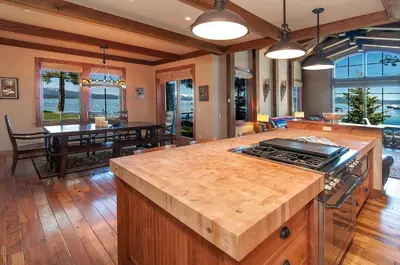 a kitchen and living room with a counter top at West Lake Serenity with 180-Degree Lake Views in Homewood