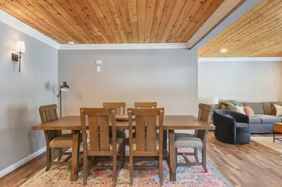 a dining room with a table and chairs at Alpine Chalet Nature Lovers Rejoice Chic 4 BDR in Alpine Meadows